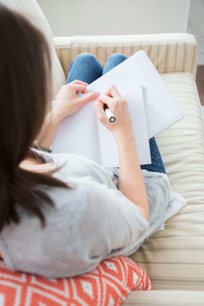 woman journaling for her mental health and stress.