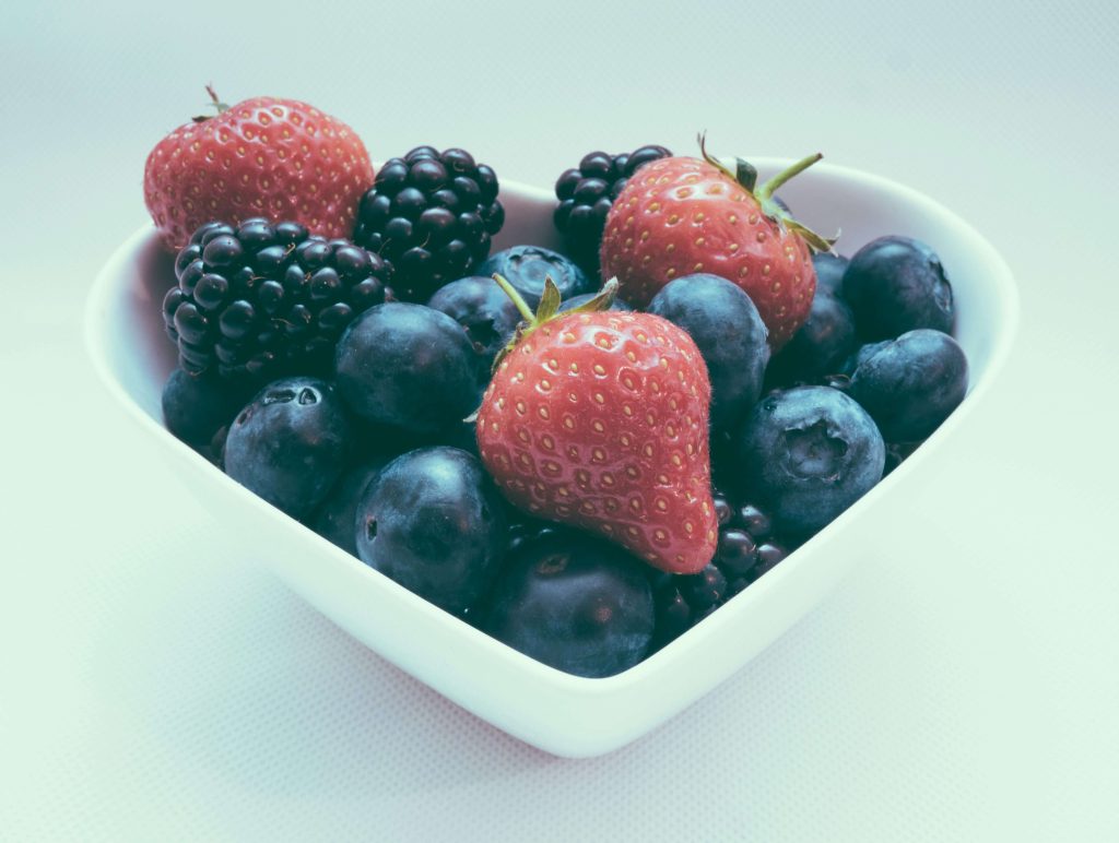 berries in a heart-shaped dish